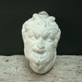 Picture of Plaster cast high-relif of an head of a faun