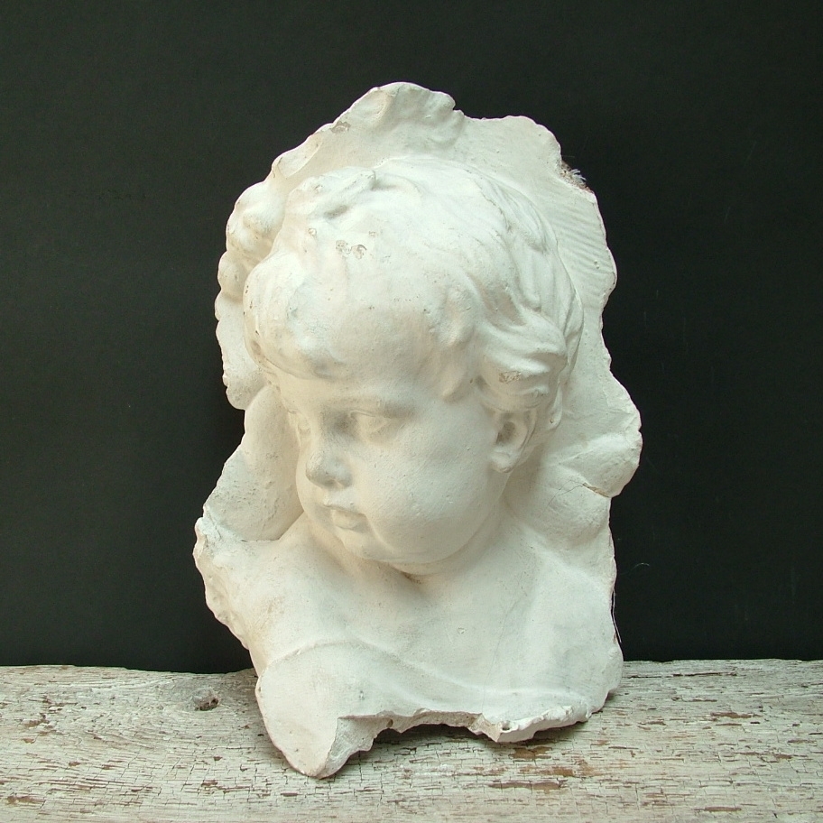 Picture of head of a Duquesnoy's little angel high-relif made in plaster