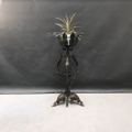 Picture of wrought iron planter with leaves