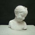 Picture of Plaster cast bust sculpture of a smiling girl
