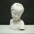 Picture of Plaster cast bust sculpture of a smiling girl